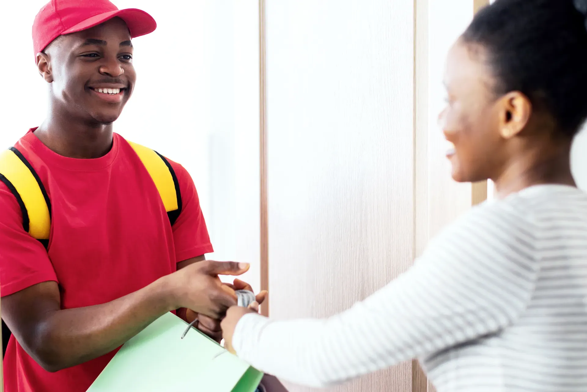 Courier delivering a package to a customer's door