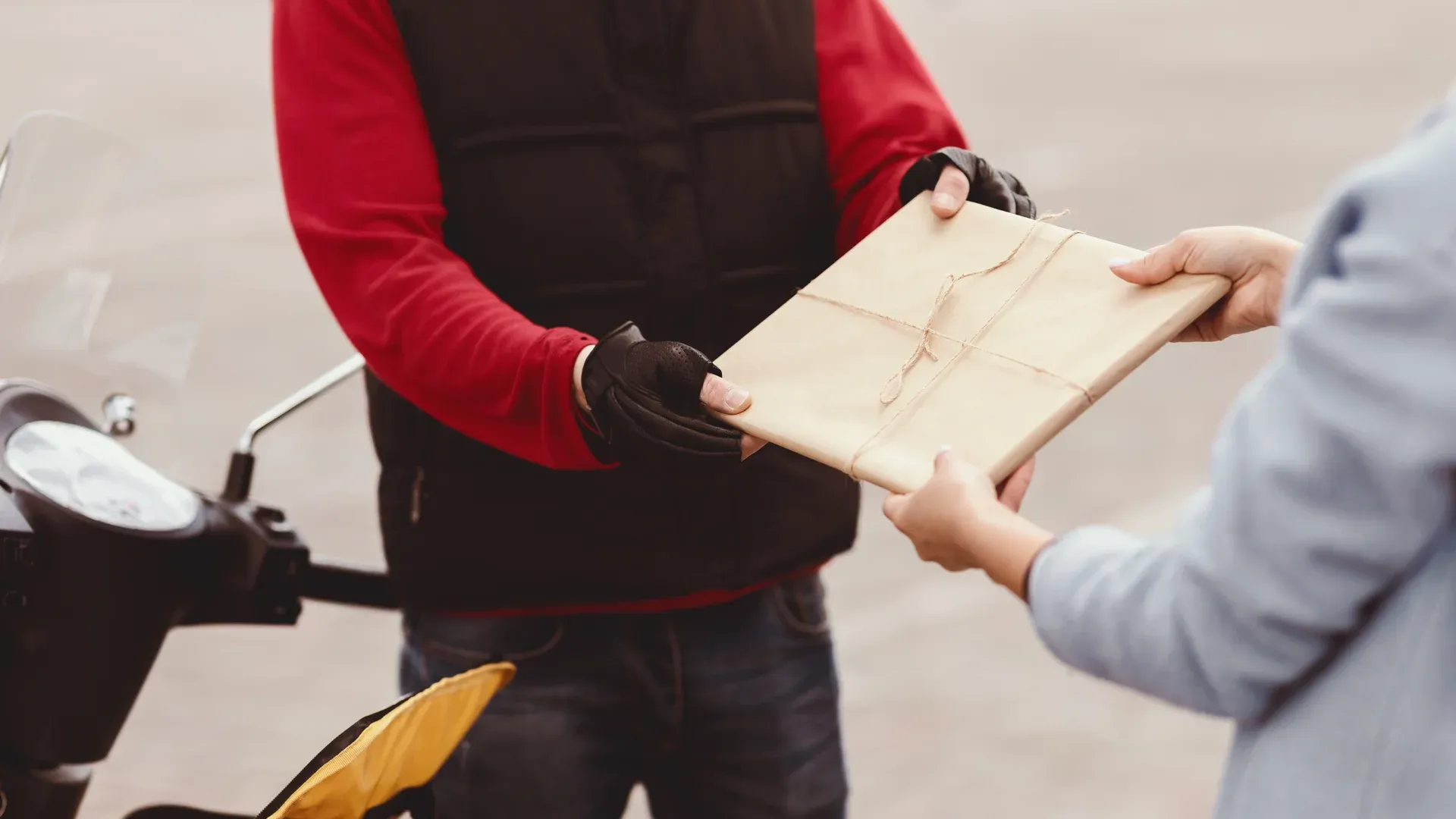 Hands carefully placing padding around a fragile item